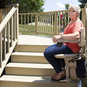 woman riding outdoor stair lift